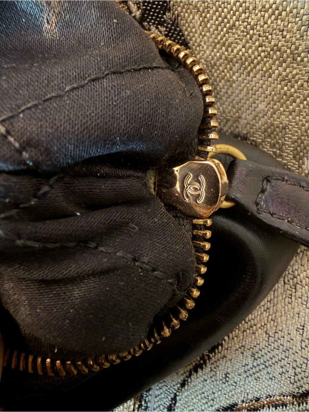 CHANEL Black Leather Clutch with Gold Chain and Tassel